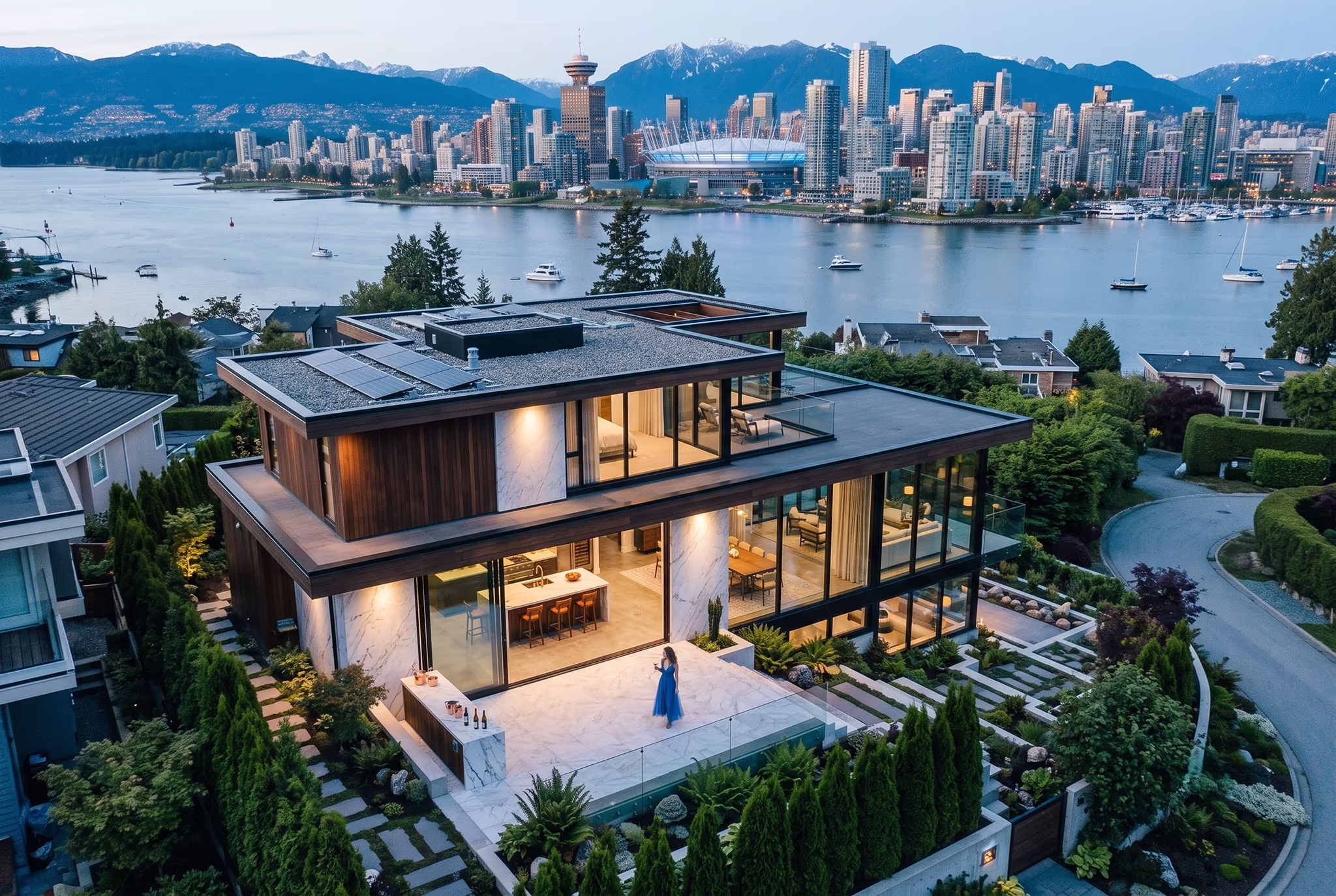 Twilight drone photo of a modern home with glowing windows